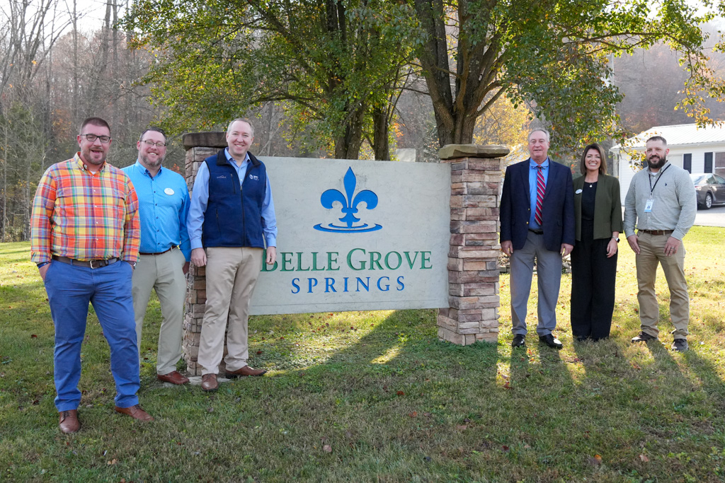 Group of people in front of sign